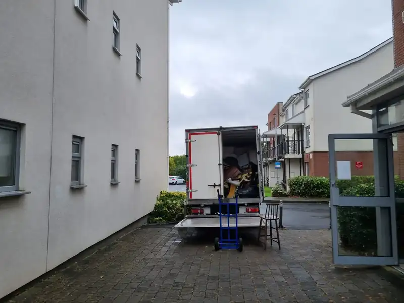 Loading the truck outside an apartment block during an apartment clearance