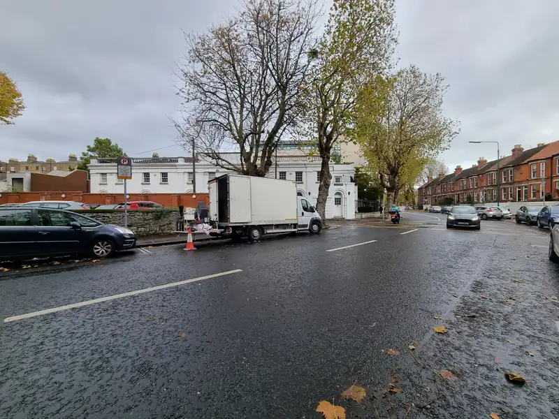 Property Clearance truck parked on a tree-lined Dublin street