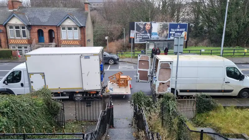 Two Property Clearance trucks on a Dublin street during a large clearance