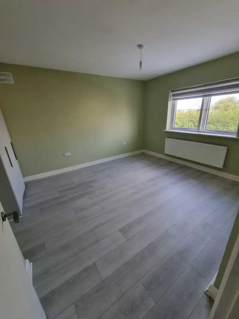 Empty bedroom left clean and clear after a house clearance in Dublin