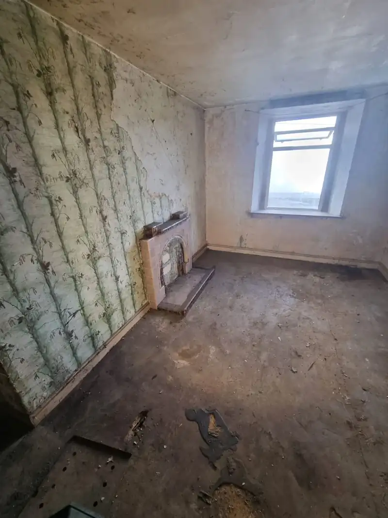 Cottage bedroom cleared and ready for renovation
