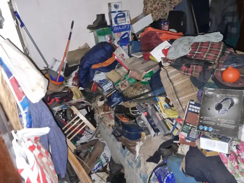 Garage packed with tools, bikes and junk before a garage clearance