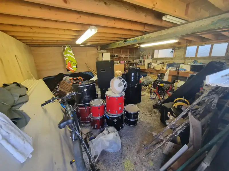 Garage clearance in progress – bulky items being sorted and removed