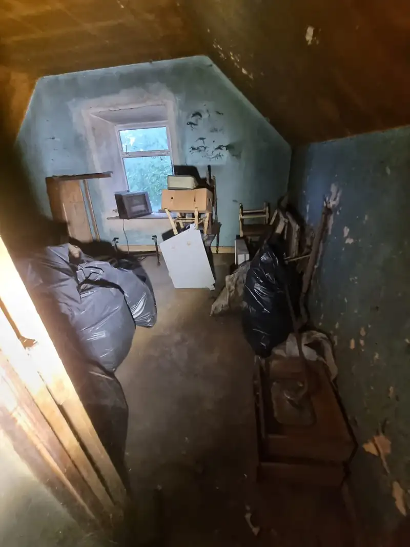 Hoarded room in a rural cottage before clearance