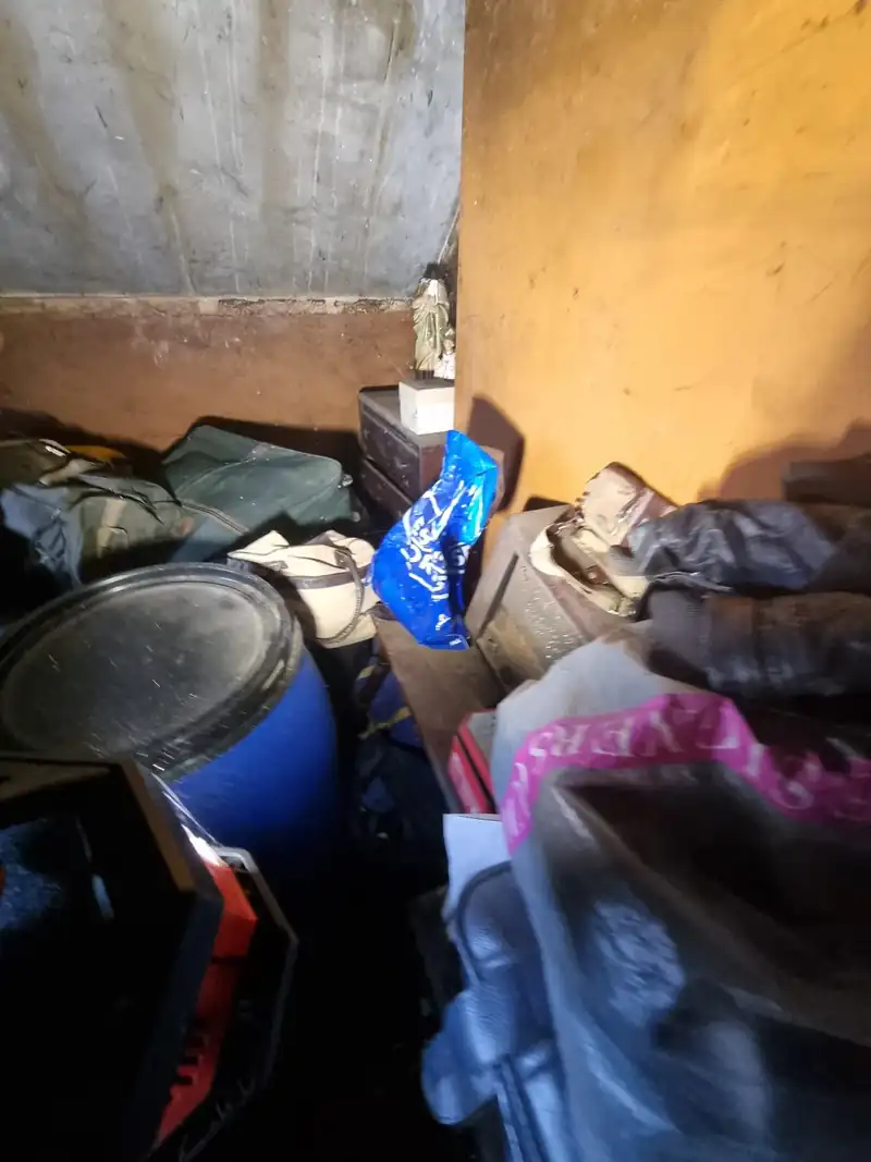 Room stacked to the walls with belongings before a hoarder clearance