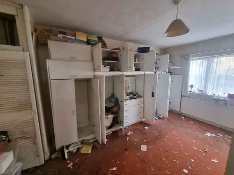 Kitchen units and cupboards being cleared out