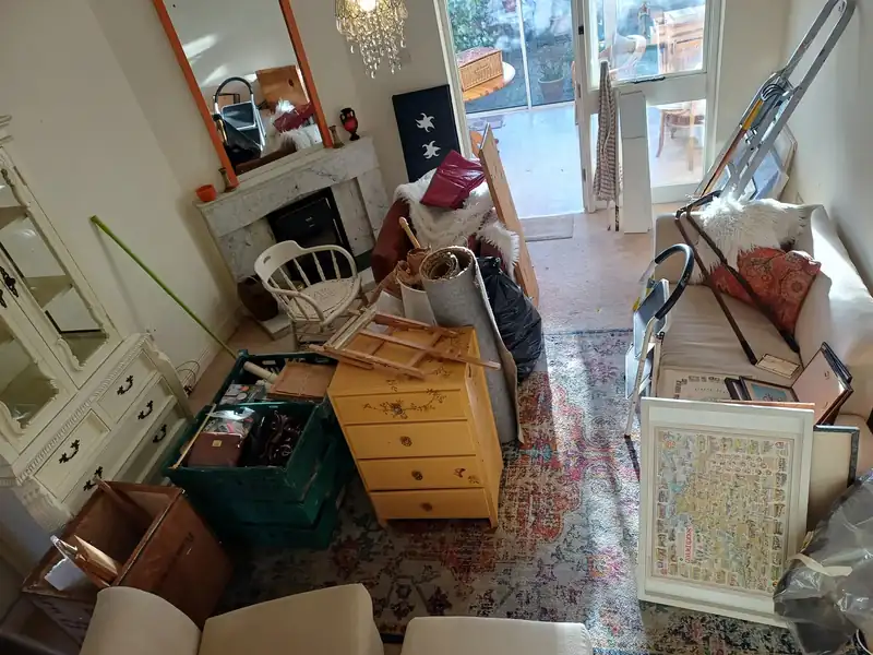 Living room contents gathered before a house clearance