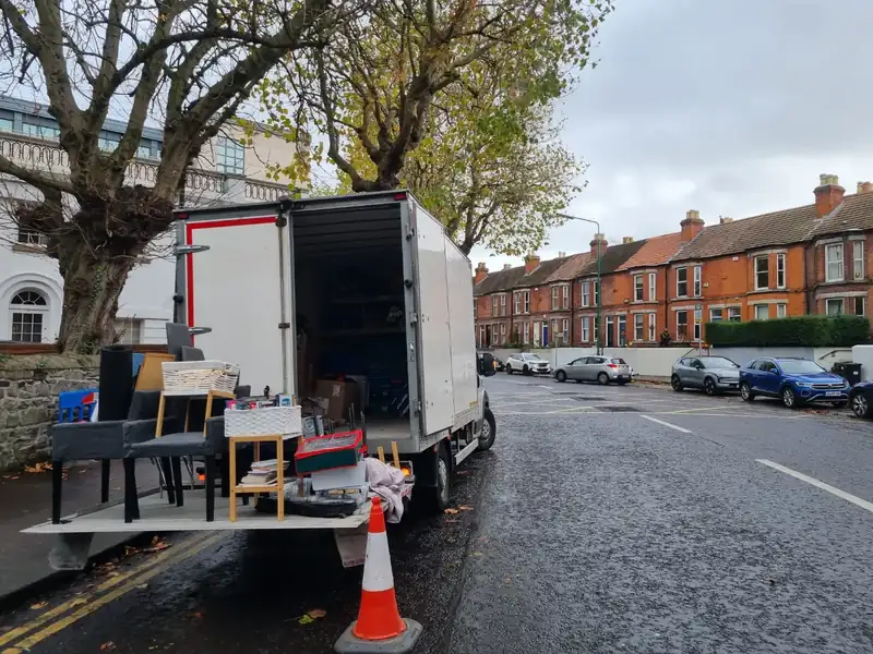 Loading the truck on a residential street during a house clearance in Dublin